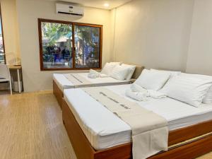 Postel nebo postele na pokoji v ubytování Happynest Rooms in Santa Fe Bantayan Island