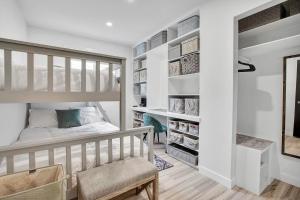 a bedroom with a bunk bed and a closet at Saskatoon 5 bedroom-Big Gatherings-Patio-BBQ-Games Room in Saskatoon