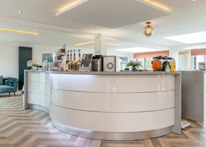 a bar in a hotel room with a counter at Crofthead in Ayr