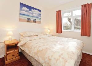 Postel nebo postele na pokoji v ubytování Anglesey Bungalows