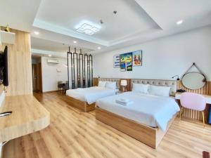 Katil atau katil-katil dalam bilik di FLC Sea Tower Quy Nhơn - Căn Hộ Du Lịch Chuẩn 5 Sao - View Biển có Hồ Bơi