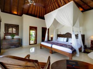 Ein Bett oder Betten in einem Zimmer der Unterkunft Villa Kedidi