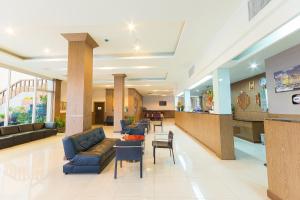 a lobby of a hospital with a couch and chairs at SinKiat Buri Hotel in Satun