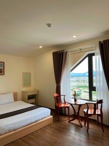 Postel nebo postele na pokoji v ubytování Villa Phong Vân + 34 fotografií