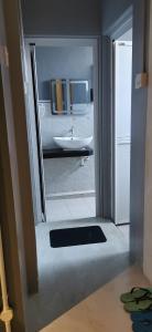 a view of a bathroom with a sink and a mirror at The Village Inn in Raub
