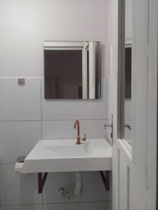 Koupelna v ubytování Kitnet Vila Marcela 1