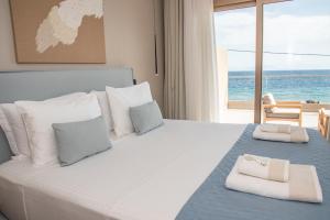 Postel nebo postele na pokoji v ubytování Kaiser Luxury Suites