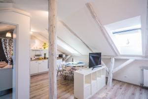 Televízia a/alebo spoločenská miestnosť v ubytovaní Pitypang Apartman Siófok
