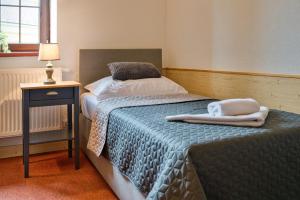 Postel nebo postele na pokoji v ubytování Hotel U Lípy