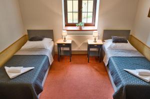 Postel nebo postele na pokoji v ubytování Hotel U Lípy