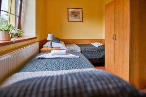 Postel nebo postele na pokoji v ubytování Hotel U Lípy