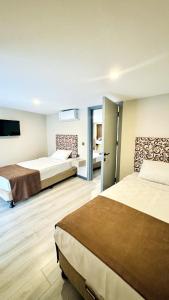 a hotel room with two beds and a bathroom at Toprak City Hotel Antalya in Antalya +38 photos