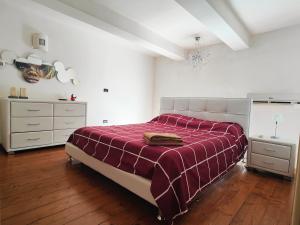 A bed or beds in a room at Appartamento Deluxe Lecce