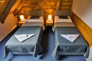 Postel nebo postele na pokoji v ubytování Hotel U Lípy