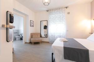 Postel nebo postele na pokoji v ubytování DOMINA Guest House