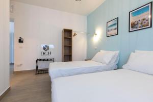 Postel nebo postele na pokoji v ubytování DOMINA Guest House