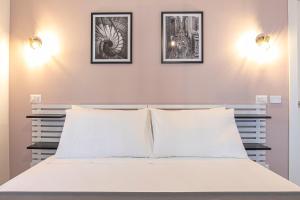 Postel nebo postele na pokoji v ubytování DOMINA Guest House