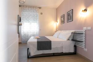 Postel nebo postele na pokoji v ubytování DOMINA Guest House