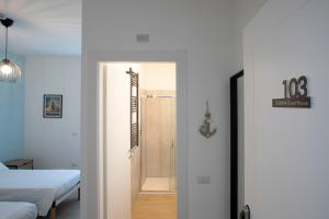 Postel nebo postele na pokoji v ubytování DOMINA Guest House