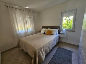 Postel nebo postele na pokoji v ubytování Villa Dijana