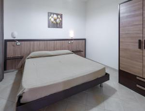 A bed or beds in a room at Villa La Vigna