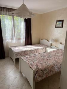 En eller flere senge i et værelse på 2 Apartment Verano Del Mar Sozopol