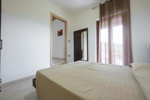 A bed or beds in a room at Villa La Vigna