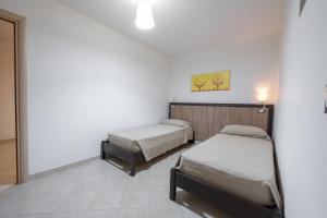 A bed or beds in a room at Villa La Vigna