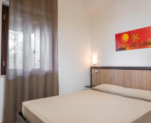 A bed or beds in a room at Villa La Vigna
