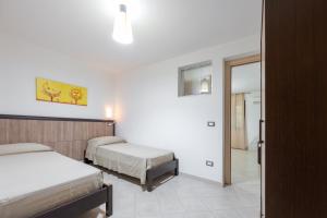 A bed or beds in a room at Villa La Vigna