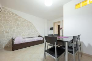 A bed or beds in a room at Villa La Vigna