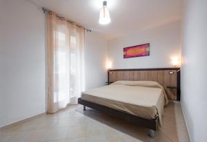 A bed or beds in a room at Villa La Vigna