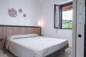 A bed or beds in a room at Villa La Vigna