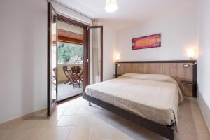 A bed or beds in a room at Villa La Vigna
