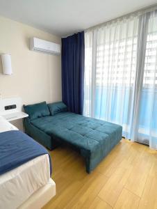Кровать или кровати в номере Apartments Black Sea Resort Luxe