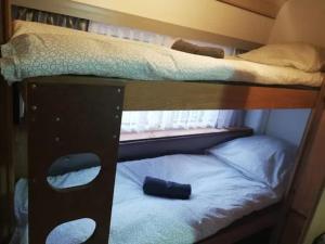 a couple of bunk beds in a room at Séjour à la ferme in Vaylats