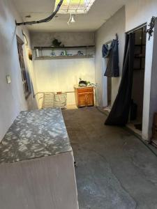 a living room with a table and a desk at Casa verano in El Barrio