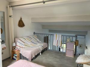 a room with a bed and a window in it at Corse Calvi appt coté Mer in Calvi