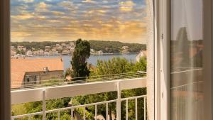 a view of a river from a window at Vista Porto Apartment in Mali Lošinj
