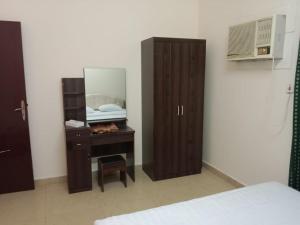 Postel nebo postele na pokoji v ubytování واحة البركة للشقق الفندقية