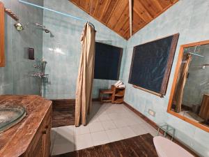 a bathroom with a shower and a sink at The Vanya, Boutique Stay in Rāmgarh