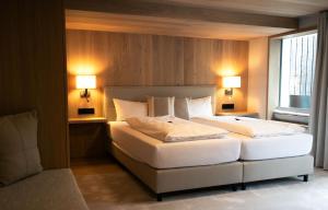 Posteľ alebo postele v izbe v ubytovaní Genuss- & Aktivhotel Sonnenburg