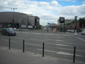 an empty street with cars driving on a city street at hotelF1 Paris Porte de Châtillon in Paris