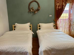 Postel nebo postele na pokoji v ubytování Sea Princess B&B