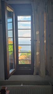 a window in a room with a view at Guesthouse Eleni in Palaios Panteleimon