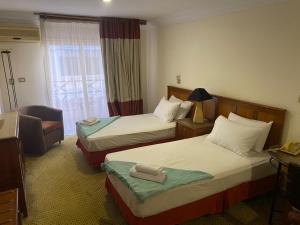 Postel nebo postele na pokoji v ubytování Bianchi Hotel