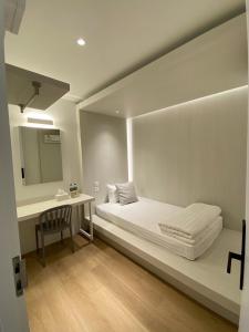 Matini Hostel grandstation客房内的一张或多张床位