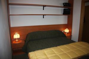 Ein Bett oder Betten in einem Zimmer der Unterkunft Albaré Solaria Montana
