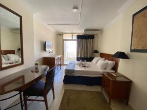 Una cama o camas en una habitación de Bianchi Hotel