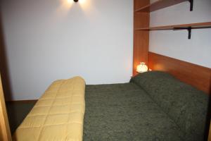 Säng eller sängar i ett rum på Albaré Solaria Montana